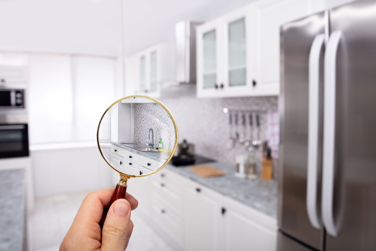 iStock-magnifying-glass-and-kitchen-view-a
